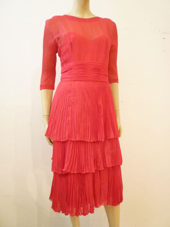 A gorgeous 50s couture cocktail dress from the later days of the celebrated House of Worth!  It is constructed from a gorgeous micro lame silk and is largely hand constructed with a bodice supported by 