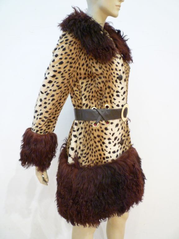 Lilli Ann Paris super mod faux leopard 60s coat with wide bands of Mongolian lamb at the collar cuffs and hem!  Leather belt with metal hardware.  Rock star chic!