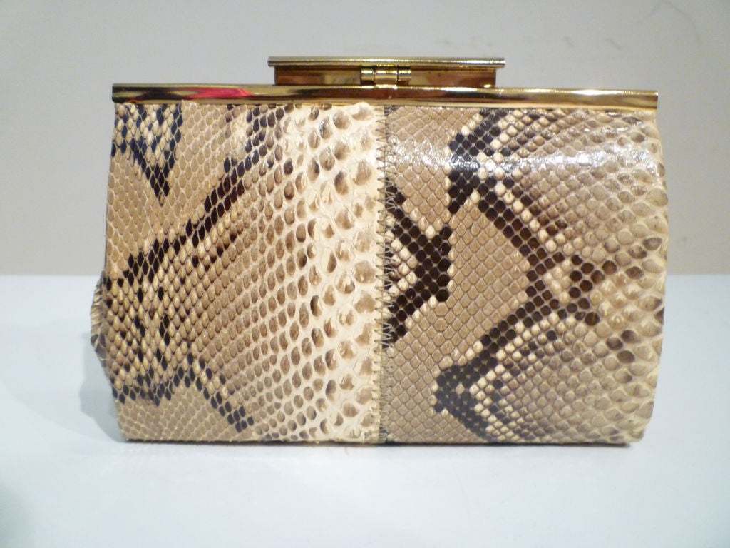 Great little snakeskin chain strap 70s disco bag from Margolin. Beige faille lining and gold tone hardware in great condition.<br />
<br />
Dimensions: <br />
<br />
7