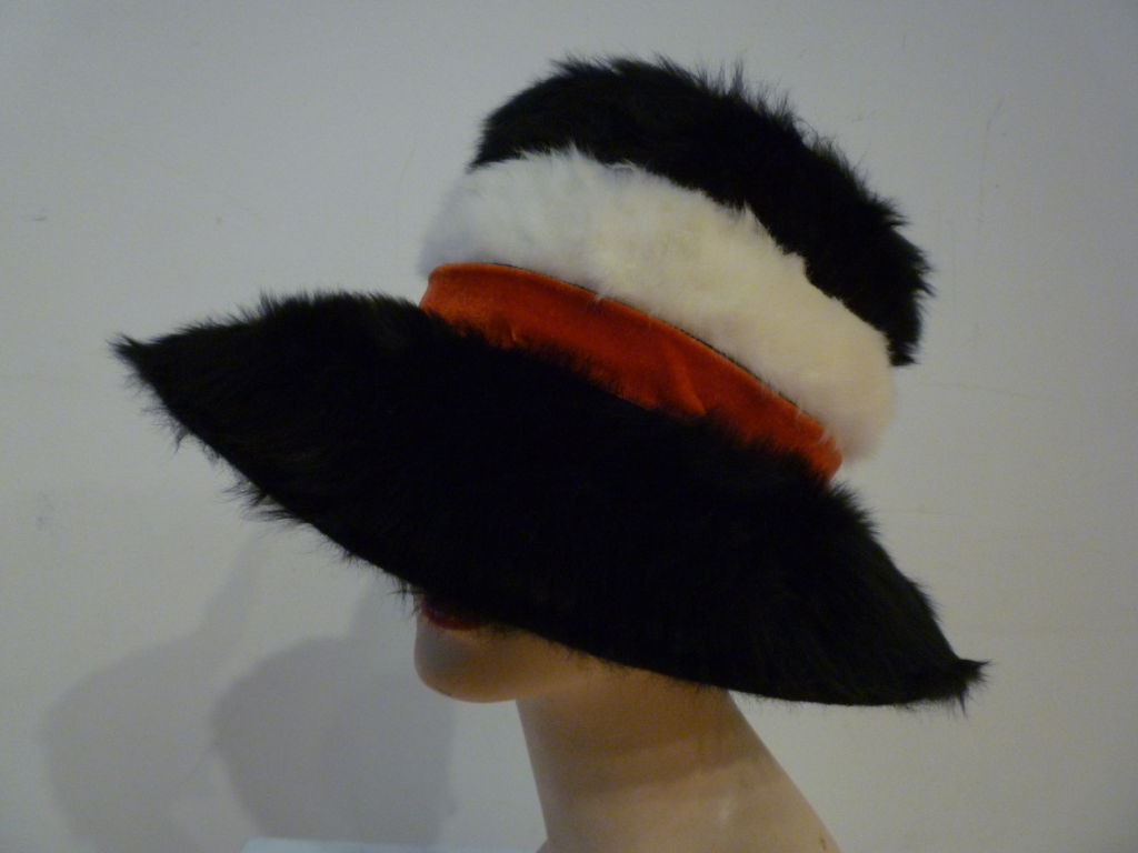 A Mr. John Jr. 60s extra plush black and white mohair fedora with red velvet band.  Funky and Fabulous!  Inner band measures 20.75