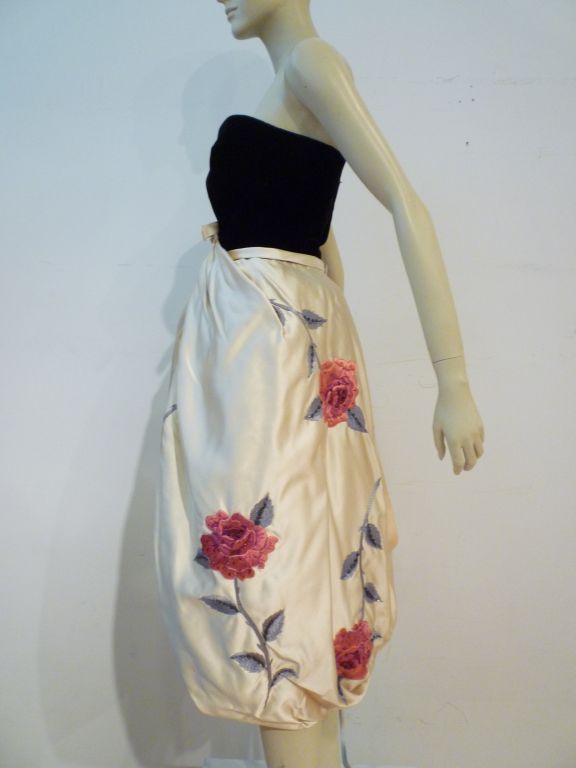 This is an amazing early 60s bubble cocktail dress by Bob Bugnand (Paris)!!  It is constructed with a silk velvet structured strapless bodice in black with a front-gathered floral embroidered silk bubble skirt.  The floral motif in shades of red and
