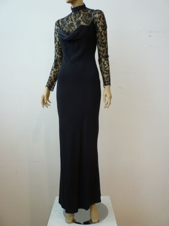 Givenchy Couture by John Galliano.  A sexy and elegant black silk lace, crepe and satin high neck, long sleeve gown from 1996 with neo-Victorian detailing and button back. Never worn, marked a French 36.