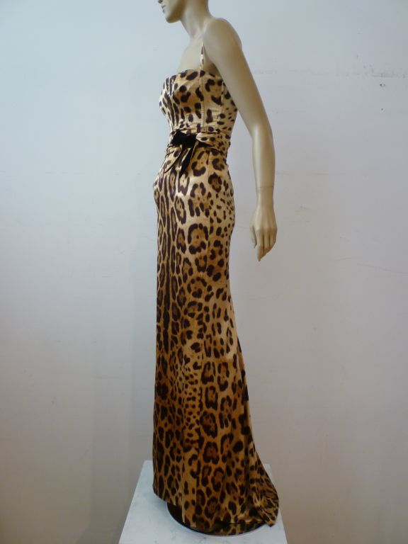A signature Dolce & Gabbana look in ferocious silk and lycra leopard print satin with a bustier, built in bra construction and <br />
bow tie waist. Never worn with tags still on!  Slinky and seductive!  Marked an Italian size 38.