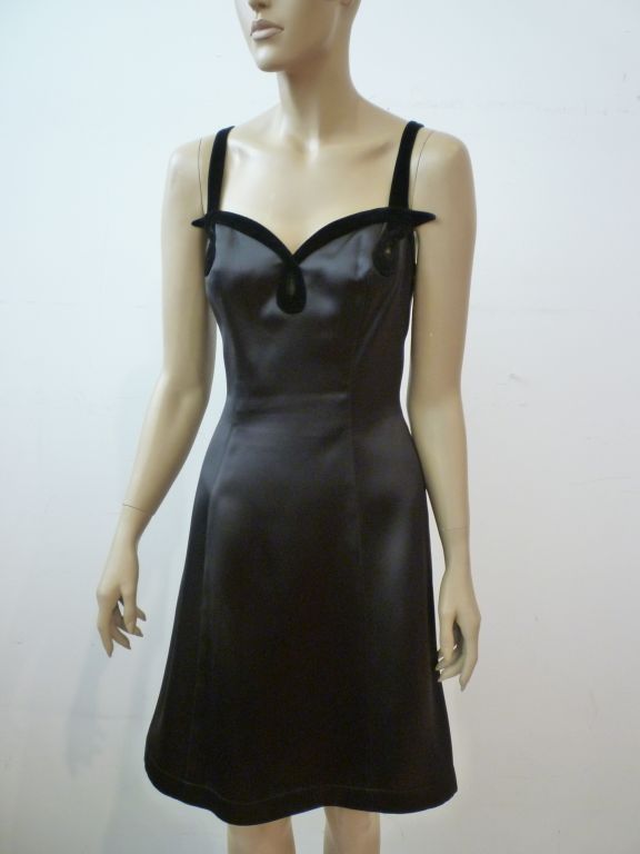 A sexy little black dress from Thierry Mugler with signature velvet trim and bust construction!  Black silk satin mini dress with a slightly flared skirt in a French size 38.  Gorgeous.