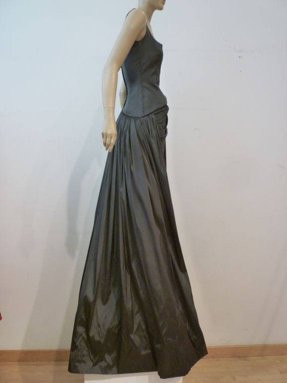 A classic Tomasz Starzewski (couturier to Lady Diana) 80s sage green column gown, draped at hip, with a HUGE train which is augmented under with tulle bustle.  Originally sold at Neiman Marcus, this gown is constructed entirely with a light stretch