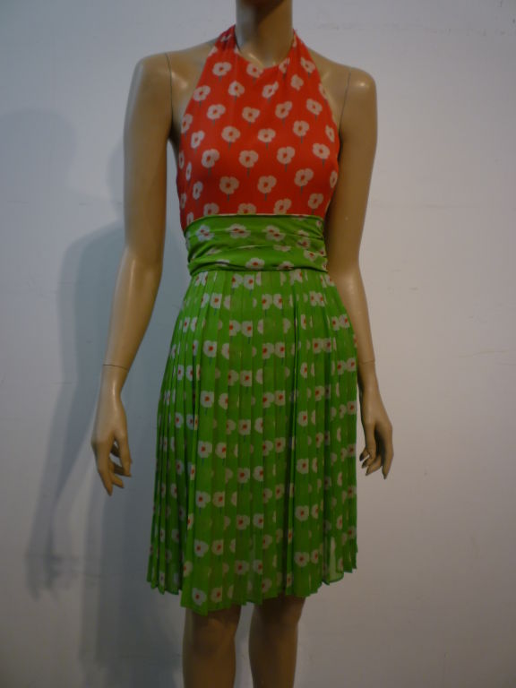 A wonderful early 70s Bill Blass silk chiffon dress in a naive daisy print.   Pleated skirt, back tie waist, and a faux 2-piece design.  So cute!  Matching scarf included.  Size 4.