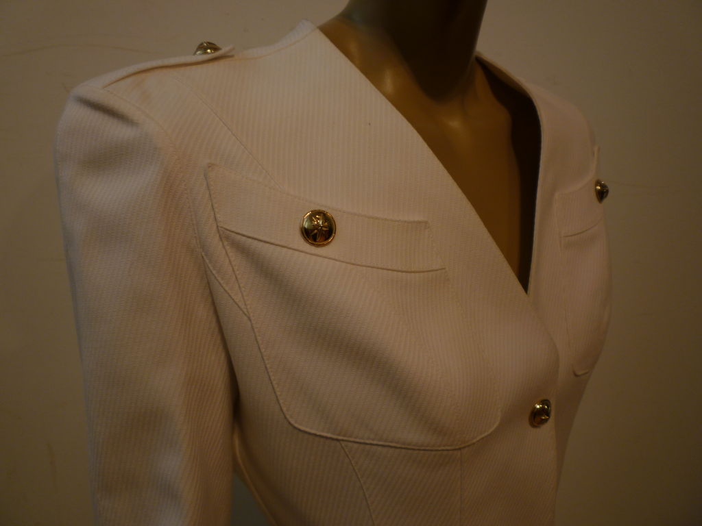 Mugler's inimitable style is apparent in this 80s white silk twill pantsuit (Pants not pictured, but ARE included) which features military styling: metal buttons, flap pockets and shoulder epaulets, in front and a dramatic cut Grecian draped back. 