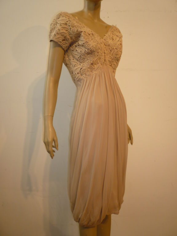 A gorgeous 1960s cocktail dress of a sandy beige-tone Belgian lace and silk chiffon draped skirt.  Inner organza structuring.  Absolutely beautiful! Unmarked Ceil Chapman.