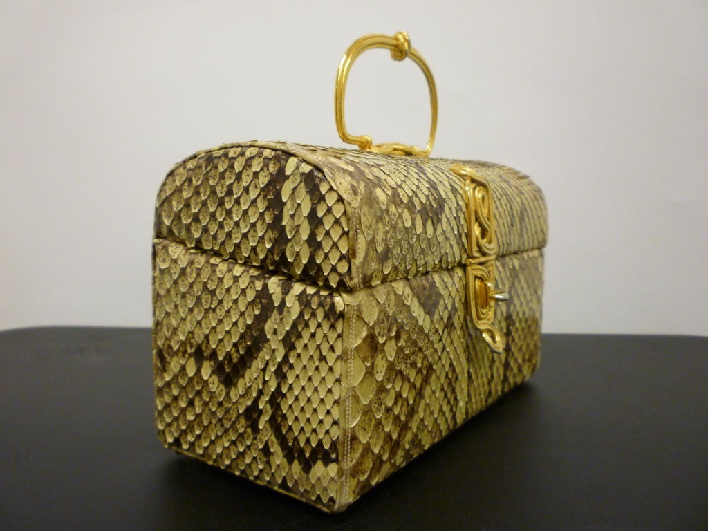 1960s Judith Leiber box bag with gold hardware and beige faille lining and matching snakeskin coin purse. Originally sold at Saks Fifth Avenue.  Measures 8