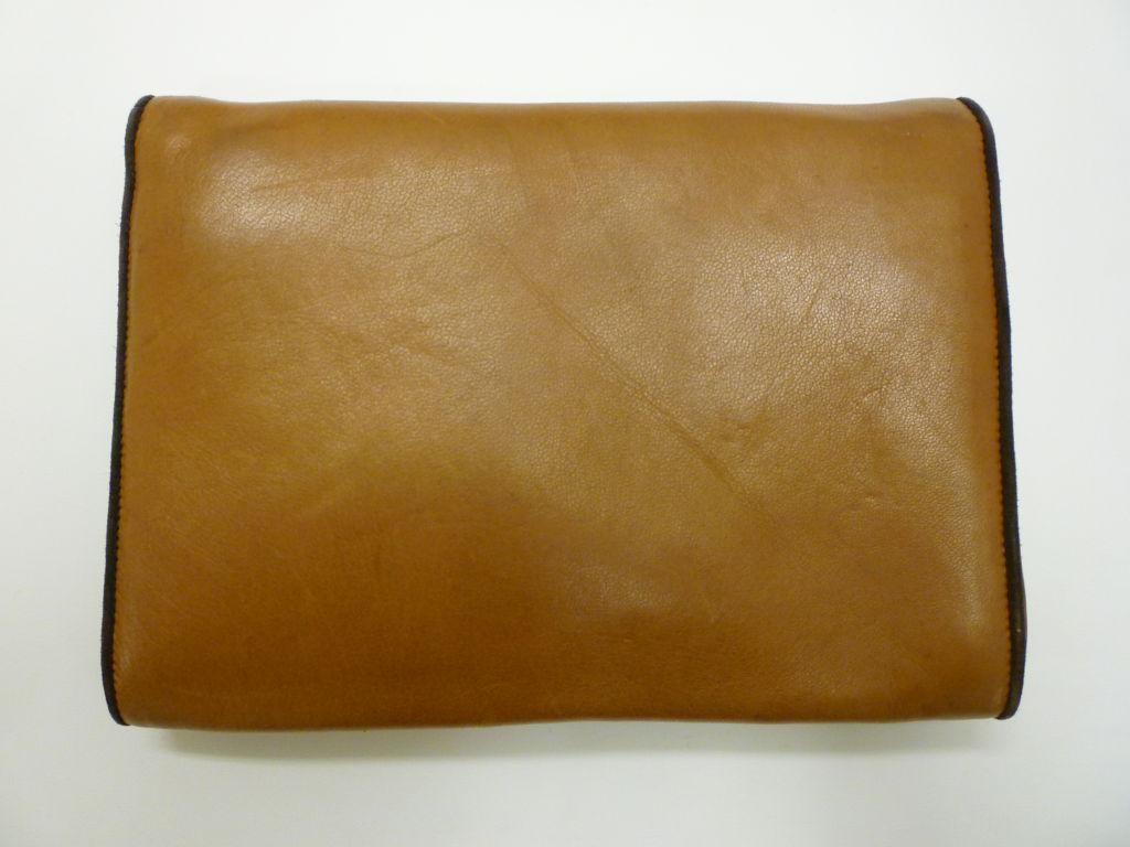 An adorable brown leather 1980s shoulder bag from Maud Frizon. Chain shoulder strap can convert to a clutch.