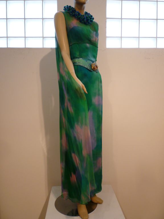 60s hand-painted silk chiffon gown w/ floaty silk chiffon overlay.  Boned rayon crepe column lining with spaghetti strap and side zipper.  Size 8