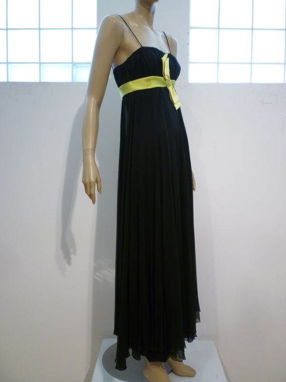 A wonderful 60s black silk chiffon gown lined in satin with empire waistline and vivid chartreuse bowed sash!  Size 4-6