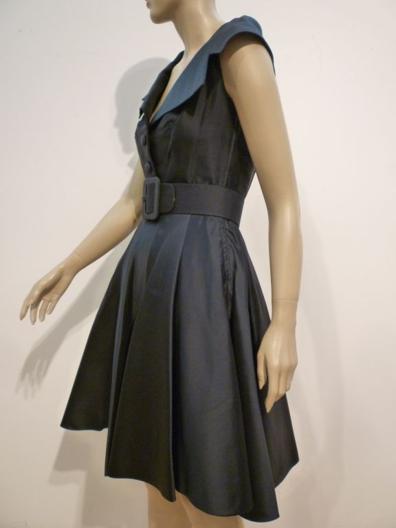 A fantastic little 60s Norman Norell navy silk taffeta cocktail dress with wide matching belt and portrait collar.  Size 4-6.