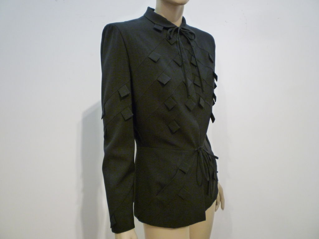 A fantastic 40s suit jacket from the legendary couturier and film costumer Gilbert Adrian in black gabardine with 