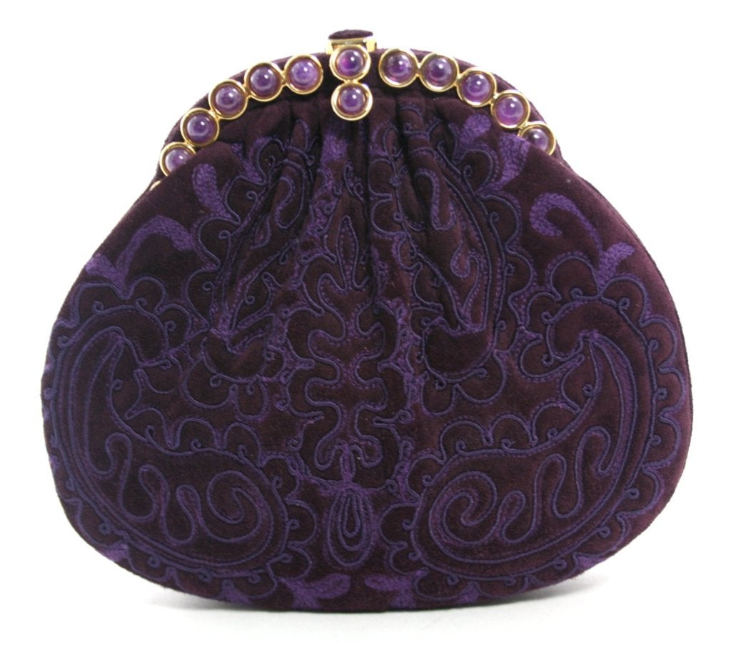 This authentic Judith Leiber Purple Suede Evening Bag is in mint condition, possibly carried once or twice.  A beautiful accompaniment for any evening affair, Ms.  Leiber’s bags are favorites among the most fashionable in Hollywood and around the