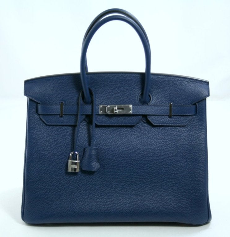 This authentic Hermès Blue Sapphire Clemence 35 cm Birkin is in pristine condition, never before carried.  It has been carefully stored and still has the protective plastic on the Palladium hardware.   Considered the ultimate luxury item the world