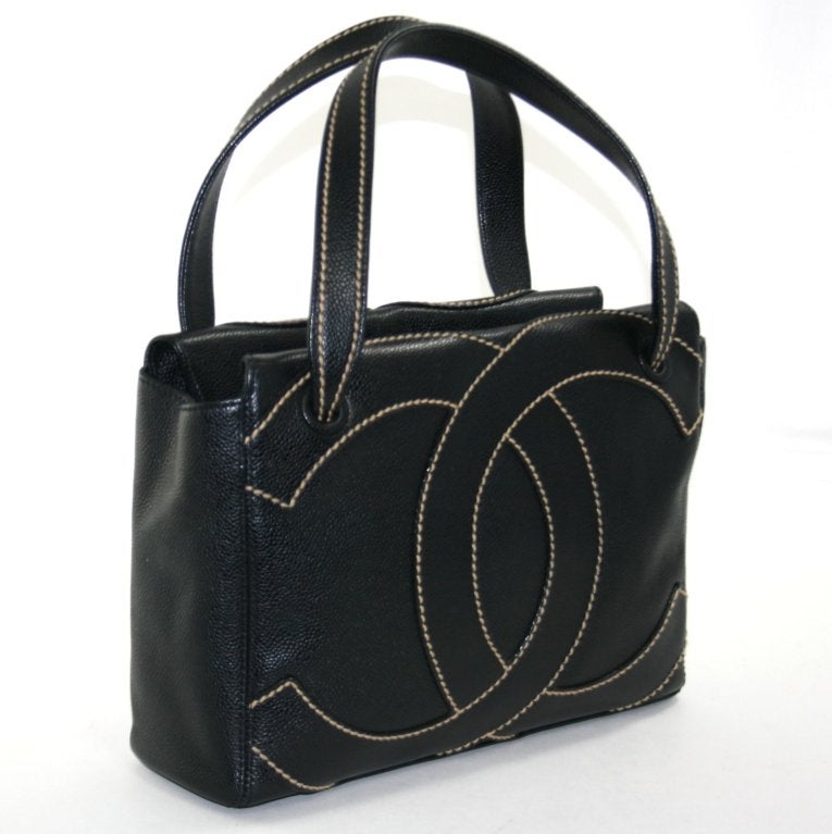 This authentic Chanel Black Caviar Leather Shopper is in excellent overall condition with only very light signs of prior ownership.  Please refer to photographs.  The classic silhouette is perfectly scaled for year round daily use in a variety of