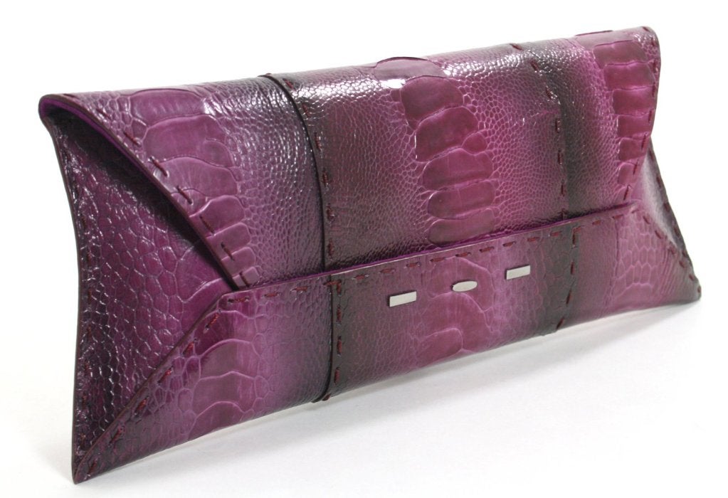 This authentic VBH Purple-Ostrich Leg Clutch is brand new.  The extremely rare hide is stunningly beautiful and is a must have for exotic lovers.
 
Brilliant purple envelope style clutch is crafted from rare ostrich leg hide.  Despite its beauty,