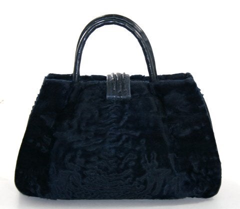 This authentic Nancy Gonzalez Midnight Blue Astrakhan Fur and Crocodile Satchel is brand new.  The sincerely stunning piece is a must have for exotic lovers.
 
Deep blue Astrakhan fur is tightly coiled lamb fleece; super soft and very distinctive.