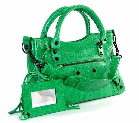 This authentic Balenciaga  Classic First Arena bag is  brand new.  In an of-The-moment vibrant green known as Vert Poker, it is a must have for Balenciaga lovers.

 While Balenciaga is known for their simple iconic silhouettes, each season's