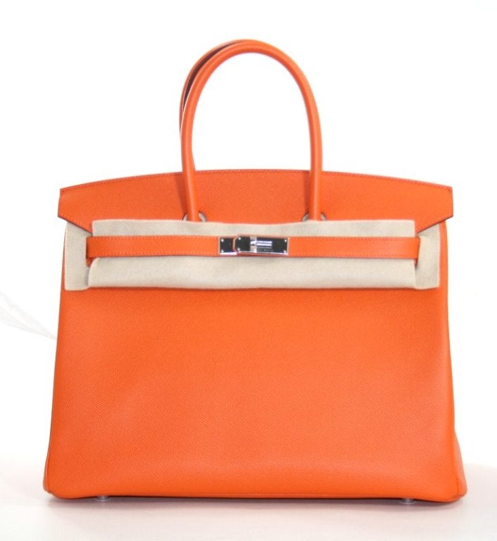 This authentic Hermès 35 cm Birkin has never been carried.  The protective plastic is intact on the hardware and it is pristine.     Hermès bags are considered the ultimate luxury item the world over.  Hand stitched by skilled craftsmen, wait lists