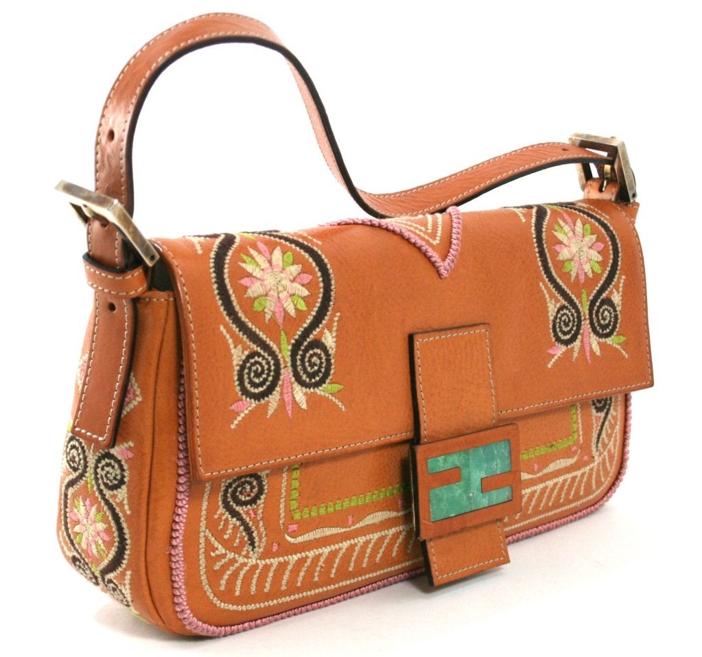 This authentic Fendi Natural Leather Aztec Inspired Baguette is in excellent overall condition with light mars consistent with gentle use and this type of hide.  The Baguette is currently created in a huge variety of fabrications and designs.  This