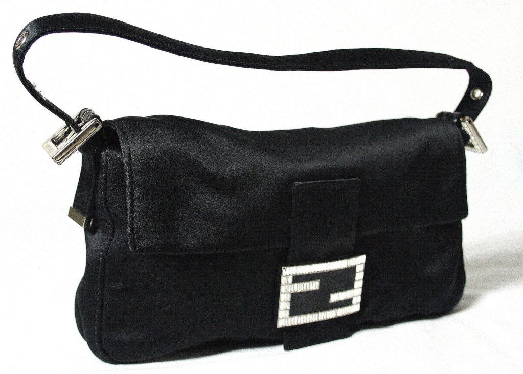 This authentic Fendi Black Satin and Crystal Baguette is in excellent condition with very minimal signs of prior ownership.  One crystal is missing from the buckle and there are few minor spots on the rear. These are very difficult to notice unless