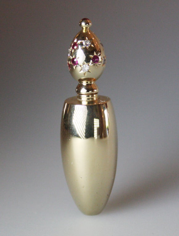 1940's  miniature perfume bottle decorated with rubies and diamonds.