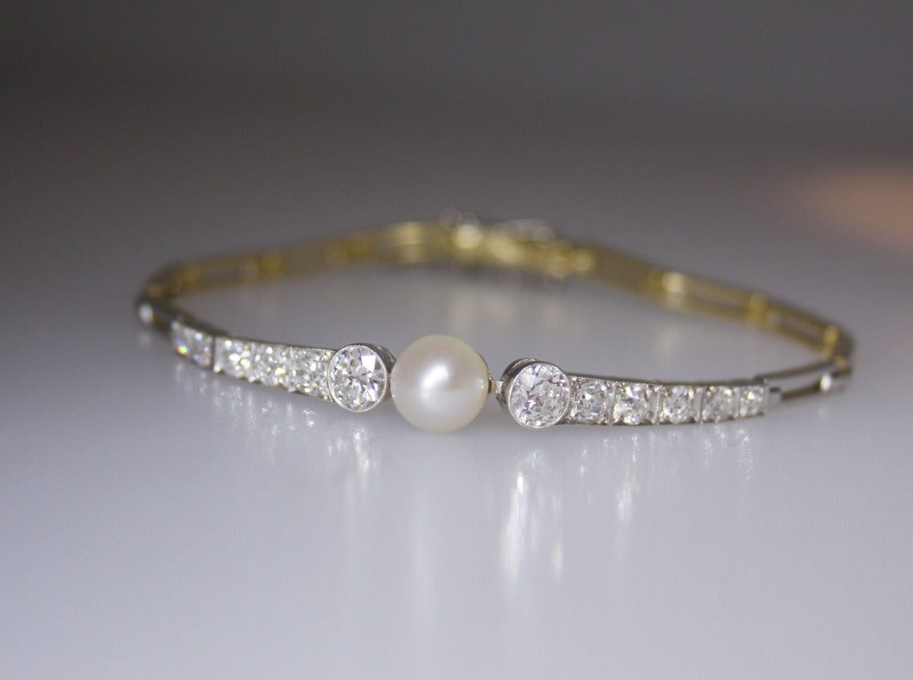 This Bracelet is centered with a 7.50mm natural pearl, and round diamonds.