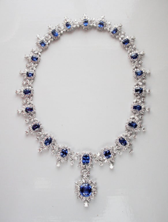 Sapphire and diamond necklace set in platinum.
23 Cushion shaped sapphires weighing 64.38 carats, further set with round, marquise and pear shape diamonds.