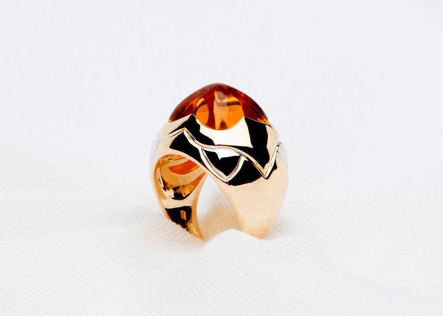 A bold statement ring.  A bright citrine glows in the center of this elegant Bvlgari pyramid ring.