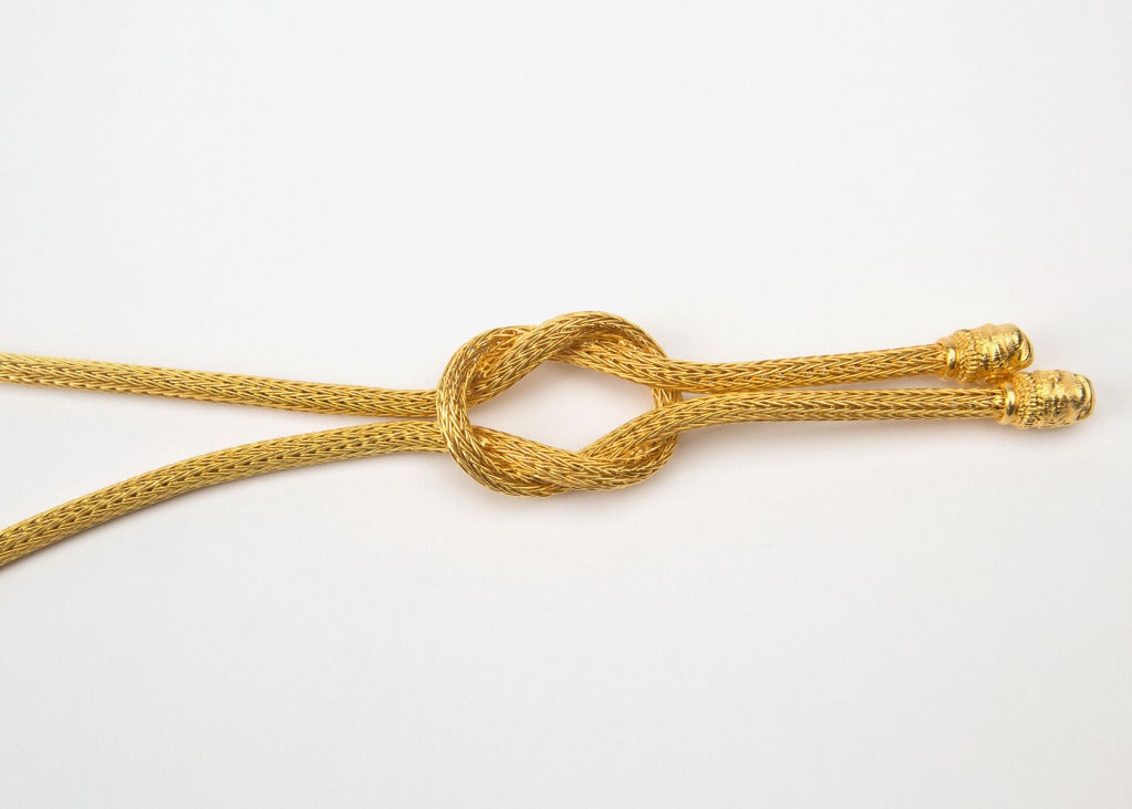 Rich flexible woven gold finished with a dramatic knot.  Simply lush!