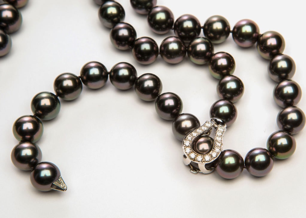 Over 37 inches of dramatic south sea Tahitian pearls, 12.0 - 11.0 mm in size.  The flexible diamond clasp allows this necklace to be worn long or short.