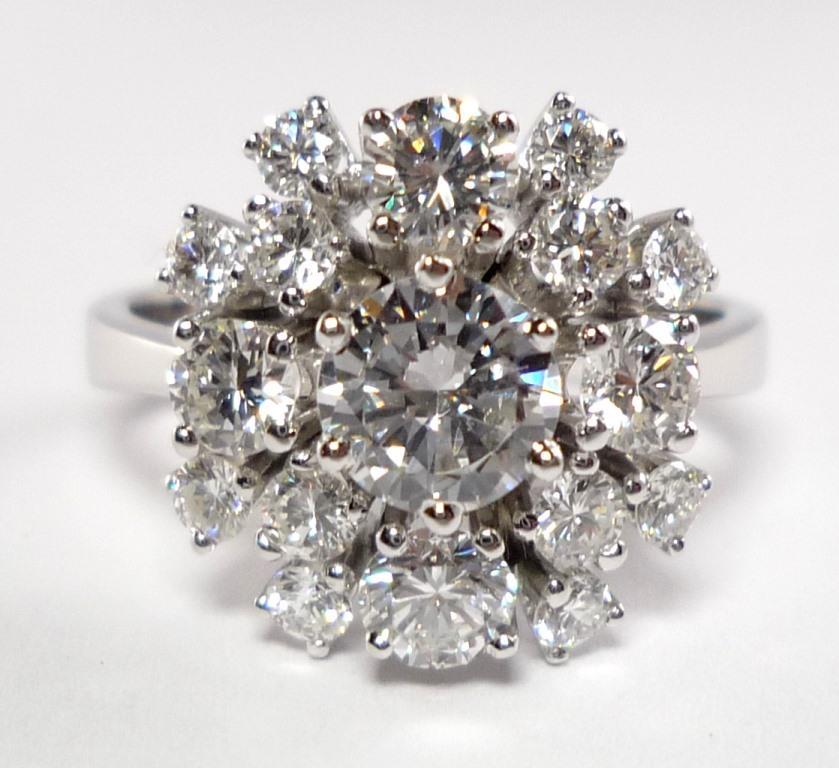 Cluster of 1.75 cts. of brillant-cut Diamonds in Top Wesselton/if-vvs.
Ring Size 7 1/4(US), 55 (European)#
Brand New, never worn.