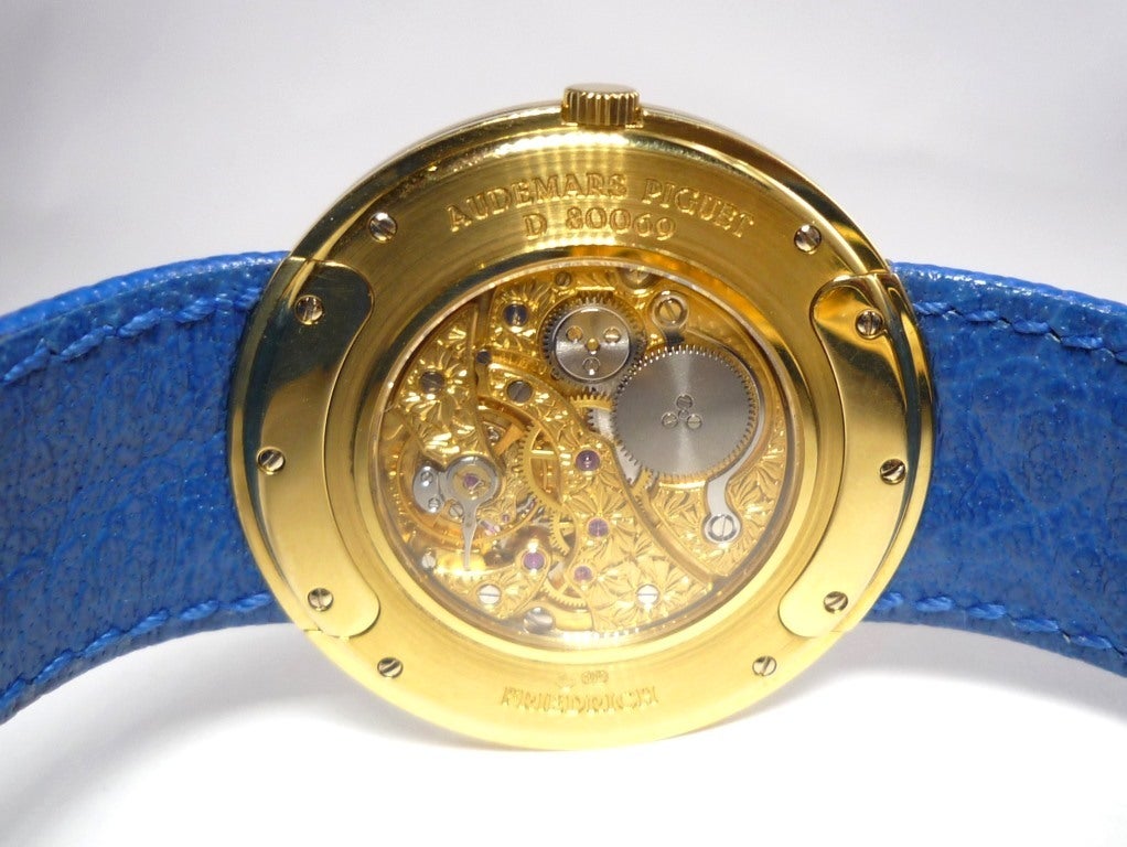 Audemars Piguet 18KT yellow gold ultrathin wristwatch with fluted bezel, retailed by Friedrich, No. D 80069.