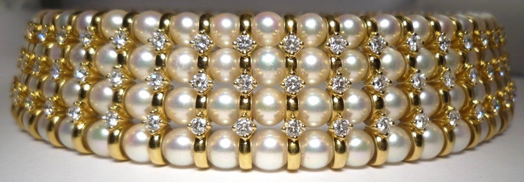 Four Strands of Cultured Pearls combined with approx. 11 cts. of brillant-cut Diamonds, mounted in 750/- Yellow and White Gold stamped 