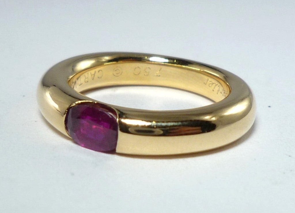 18k Yellow Gold band ring with a oval ruby, stamped and numbered by CARTIER
European 49, U.S. 5