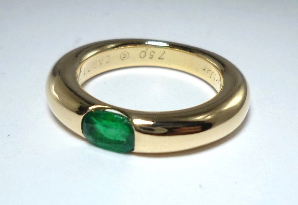 18k Yellow Gold band ring with a oval Emerald, stamped and numbered by CARTIER