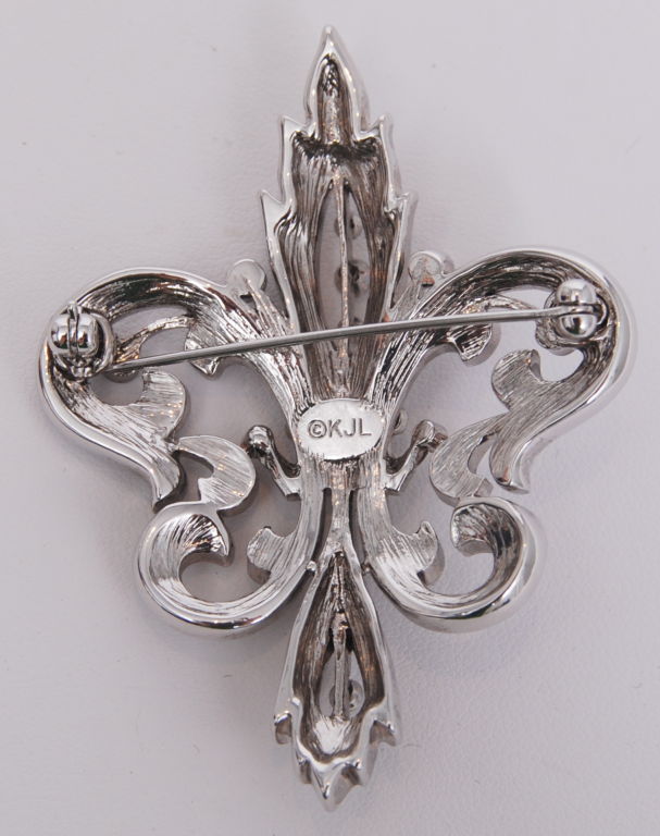 Kenneth Jay Lane crystal rhinestone fleur-de-lis brooch.