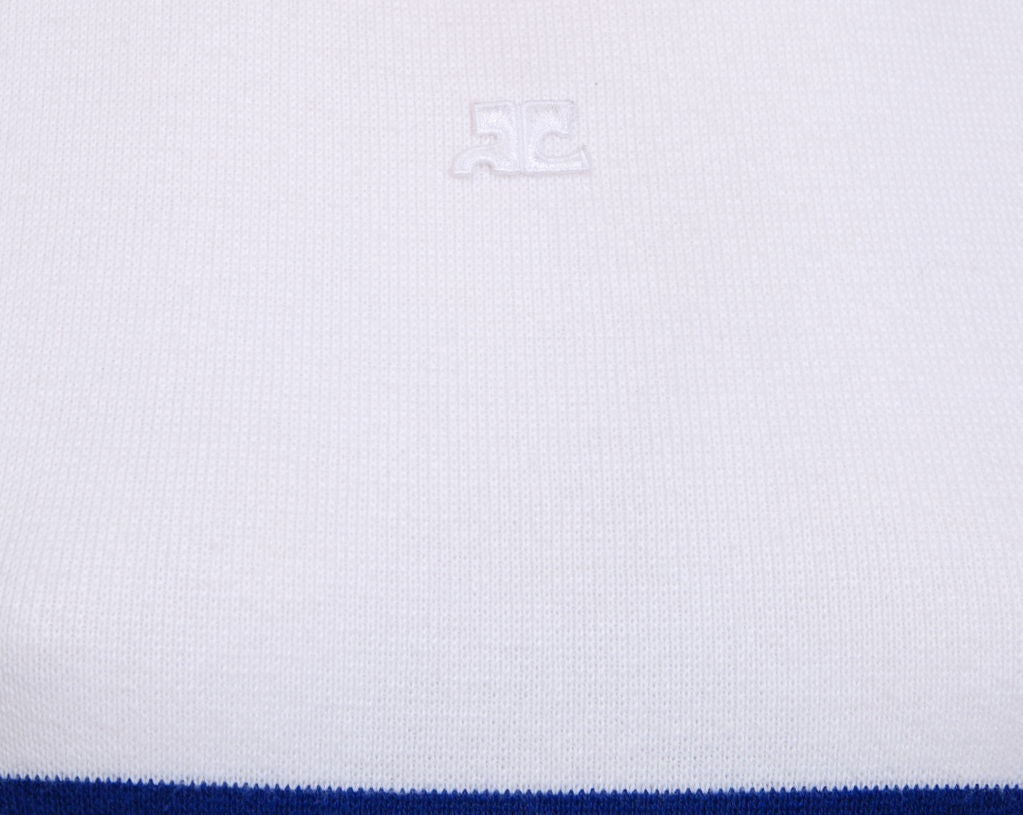 Sleeveless, blue and white nautical stripe knit dress. Courreges logo at top center.<br />
This piece is an easy every day spring essential for any wardrobe.
