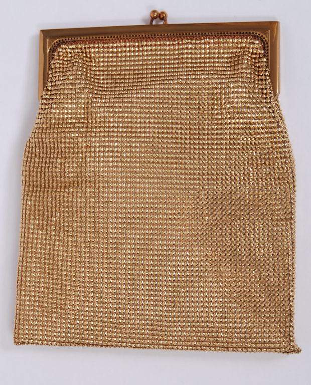 Whiting and Davis gold domed mesh fold over frame clutch with peach colored grosgrain lining.
