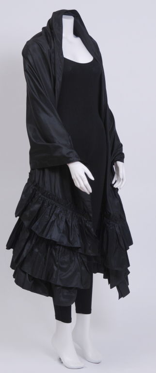 Black silk organza opera wrap with a three tired fringe ruffle at each end. Can be worn various ways with a casual pair of jeans or a ball gown. Labeled Christian Dior Boutique.