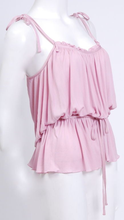 Holly's Harp rose colored, silk jersey, spaghetti strap drawstring blouse.<br />
<br />
Mrs. Harp captivated Hollywood with a rich hippie look in the 1960's and enthralled New York with soft clinging designs. She was nominated for Coty awards