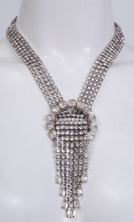 Dramatic lariat style rhinestone necklace with adjustable length closure.