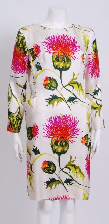 Bright floral printed, long sleeved dress with pockets. Fully lined in silk. Worn by Debbie to the Victoria Secret fashion show, 2008.<br />
<br />
Debbie Harry began her musical career in the late 1960s with folk rock group The Wind in the