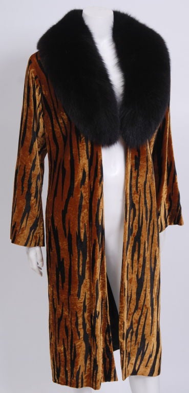 Luxurious silk velvet lightweight open coat with black long haired fox fur collar. Fully lined in silk. Can be worn as an dinner coat or outerwear.