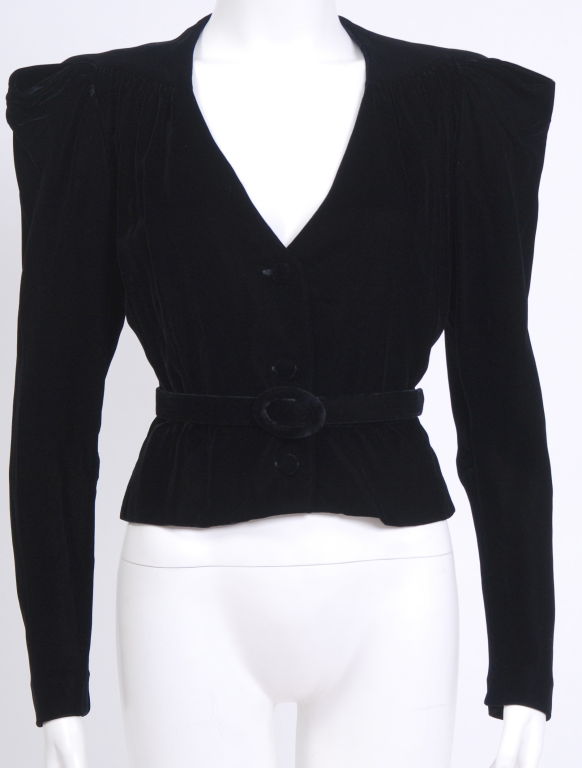 Ultra soft, dense black silk velvet blazer with 40's style puckered, exaggerated shoulders, tapered arms, nipped waist with three matching velvet covered buttons, detachable velvet belt. fully lined in black silk.<br />
<br />
Last photos have