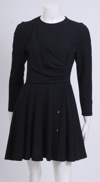Black silk crepe long sleeve dress with resin and rhinestone buttons down skirt and at wrists. Labeled Valentino Miss V.