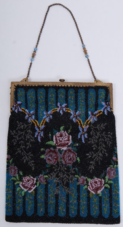 Intricately detailed antique beaded purse. Brass metal frame with chain and glass bead decorated strap. Large in size and kept in absolute pristine condition.