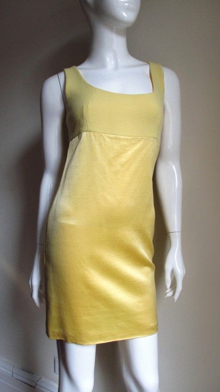 A lovely butter yellow silk dress and jacket set from Gianni Versace's istante collection.  The sleeveless fitted dress is simply cut with a scoop neckline and light weight wool matching upper bodice front and back.  Fully lined in matching silk and